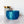 Blue geometric-patterned vase with a gold crown on a white surface